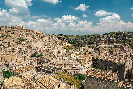 Matera (Basilicata, Italy) is located on a canyon, which defines Matera’s landscape and architecture. Inhabited since the Paleolithic era, established by the Romans in the 3rd century BC, the town is famous for its cave dwellings. The Sassi di Matera is the ancient town of houses carved into the rock. People lived here until the 1950s, but then they were moved because the place needed restoration. Today pubs, restaurants and hotels are found in this location.