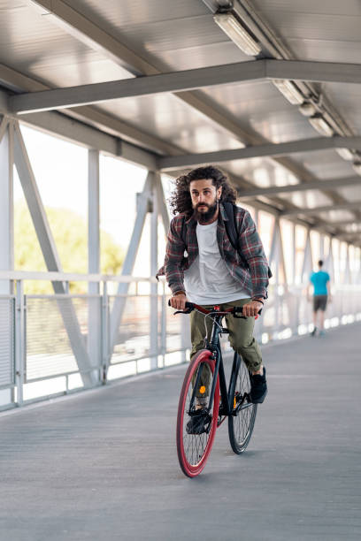 istock Bearded Man Riding Bike 1433834301