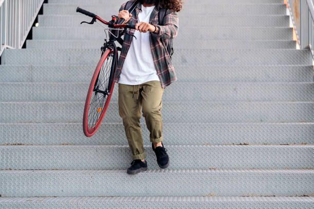 istock Man Carrying his Bike 1433834356