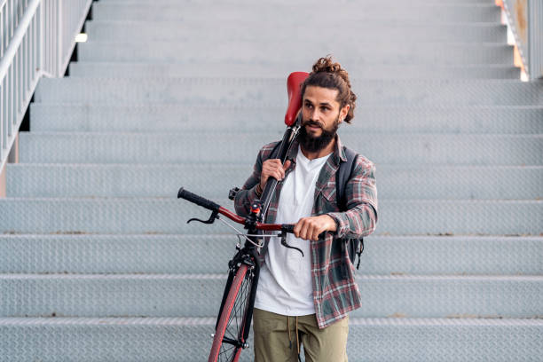 istock Bearded Man Carrying his Bike 1433834389
