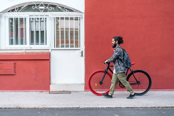 istock Happy Man Walking with his Bike 1433834758