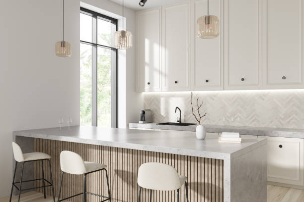istock Stylish kitchen interior with bar countertop, decor and panoramic window 1433835386