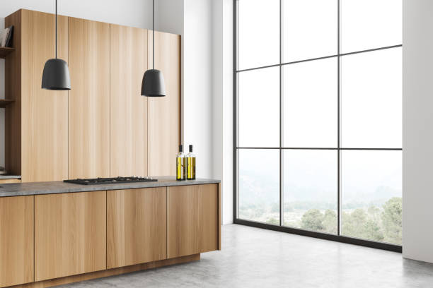 istock Light kitchen interior with bar countertop, shelves and panoramic window 1433836149