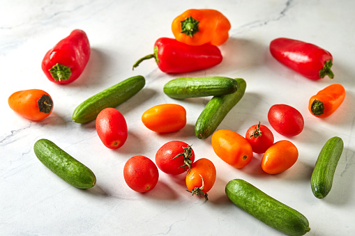 Collection of large variety of multi colored ripe tomatoes isolated on white background. DSRL studio photo taken with Canon EOS 5D Mk II and Canon EF 100mm f/2.8L Macro IS USM