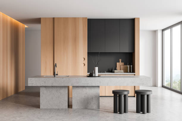 istock Modern kitchen interior with island and seats, kitchenware and window 1433838506