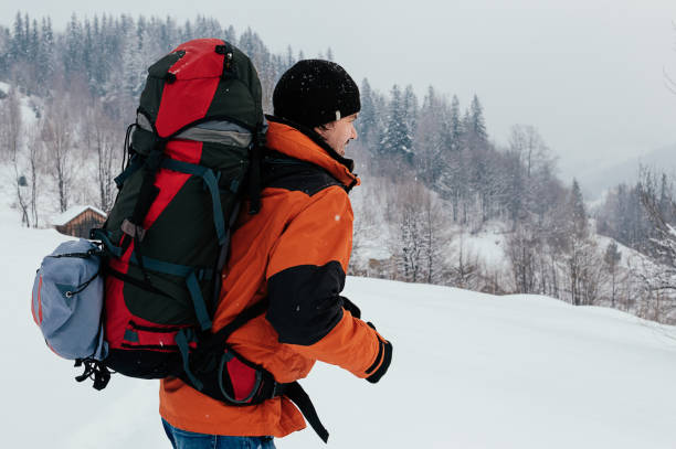 istock backpacker walking in snow mountain landscape 1433839597