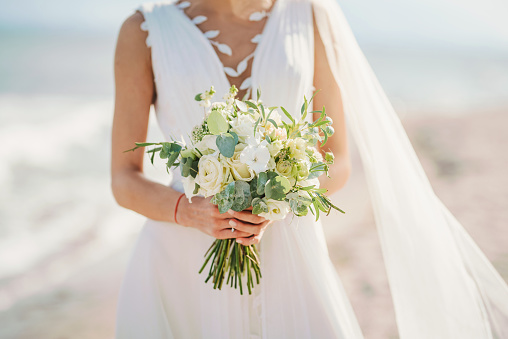 Bridesmaid's bouquets, wedding bouquets closeup. Stylish summer wedding. Contemporary fashion wedding trends. Elegant beautiful style. Modern concept.