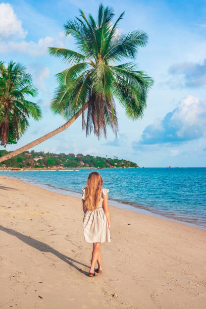 istock Mature woman on tropical beach 1433841101