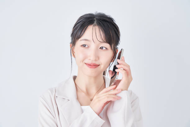 istock young woman holding a smartphone 1433843156