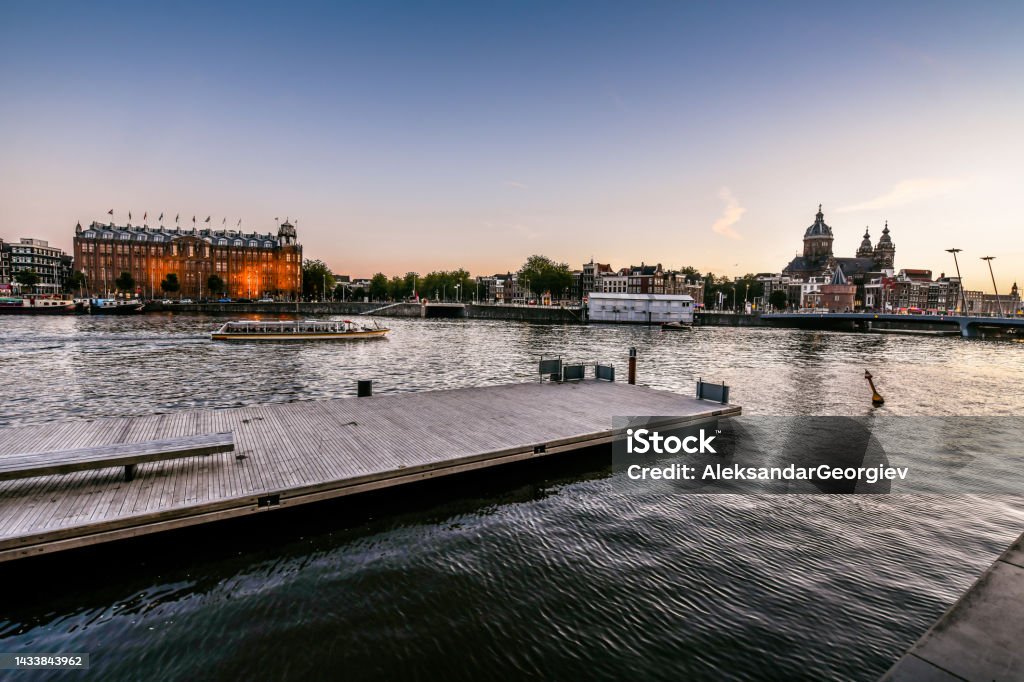 Majestic Oosterdok Overlooking St. Nicholas Church In Amsterdam, The Netherlands Water Stock Photo