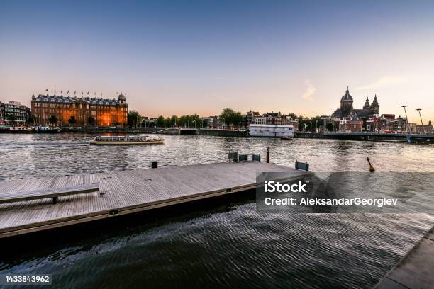 Majestic Oosterdok Overlooking St Nicholas Church In Amsterdam The Netherlands Stock Photo - Download Image Now