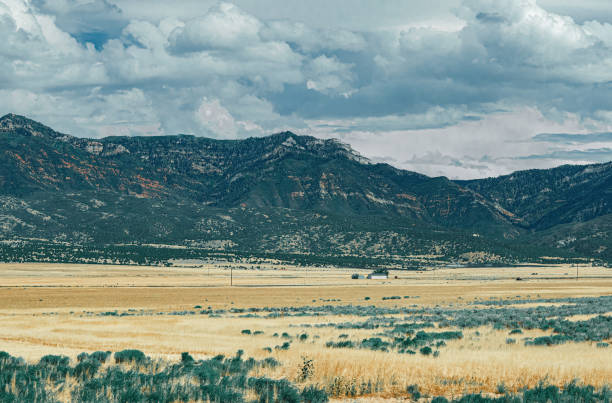 Low Angle Telephoto Sunset shot of the La Salle Mountain peaks near Moab in Southwest Utah.