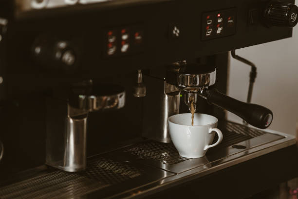 istock espresso machine in coffee shop counter offering freshly brewed coffee. coffee maker concept. 1433847610