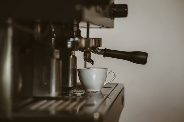 istock espresso machine in coffee shop counter offering freshly brewed coffee. coffee maker concept. 1433847968