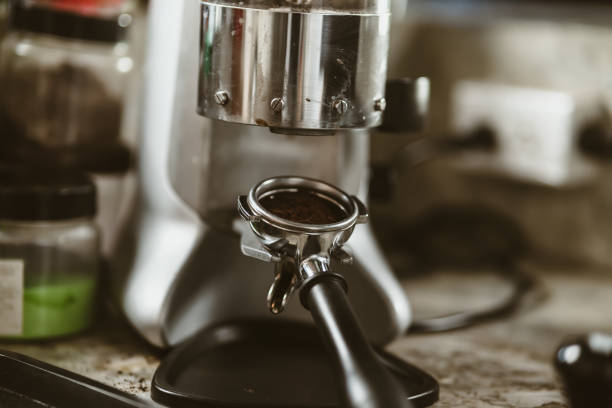 istock bottomless filter with grinder machine at coffee shop. coffee maker concept. 1433848036