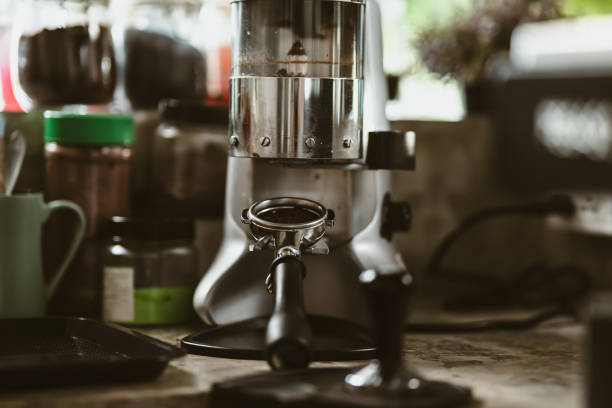 istock bottomless filter with grinder machine at coffee shop. coffee maker concept. 1433848837