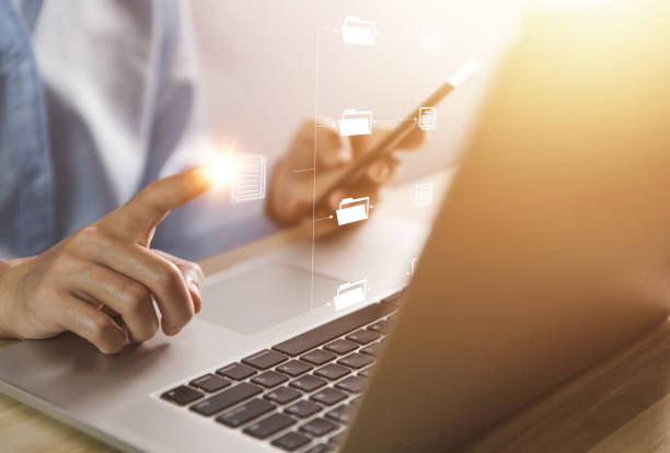istock business people use computers to manage electronic documents The concept of efficient access to an online corporate business document database. Internet file system Digital technology paperless office 1433849447