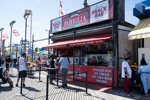 Brooklyn, NY, USA - June 5, 2022: Famiglia Pizzeria on the Coney Island Boardwalk.
