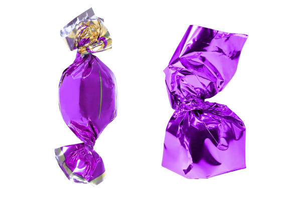 istock Two purple wrapped candy isolated on a white background 1433850514
