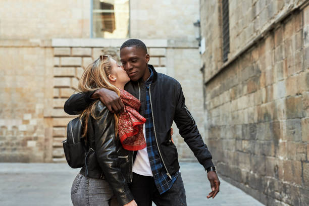 istock Loving girlfriend kissing her boyfriend. 1433853580