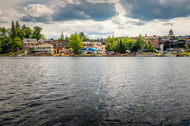 Huntsville, Canada - August 17, 2022: View from Fairy Lake to Huntsville in Canada. Lots of shops and restaurants along the water.