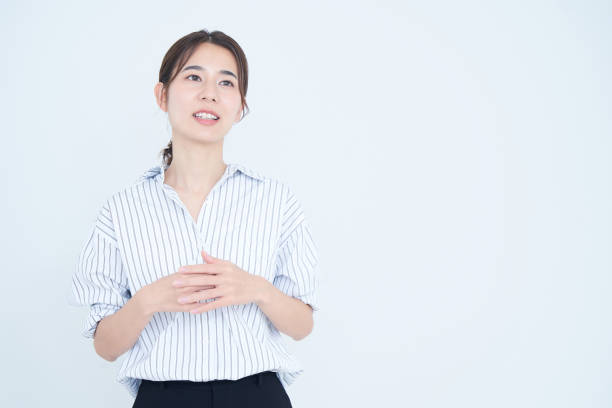 istock business woman speaking and white background 1433854699