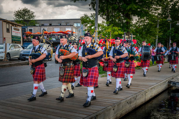 Huntsville, Canada - August 17, 2022: Bagpipers marching in Huntsville in Canada.