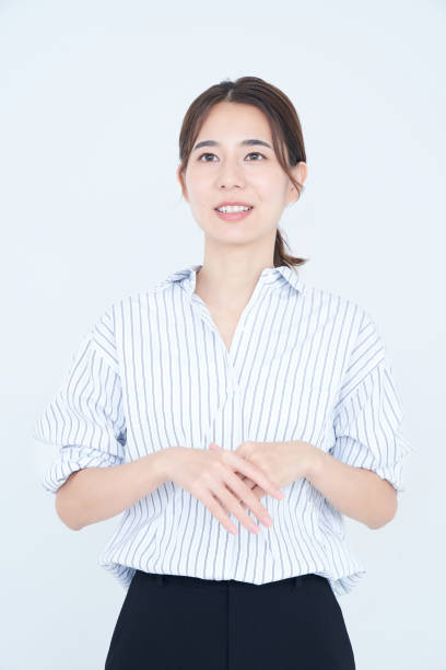 istock business woman speaking and white background 1433854823