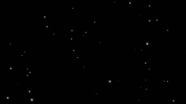 istock Glittering particles rising on a black background, particles 1433856323
