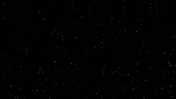 istock Glittering particles rising on a black background, particles 1433856341