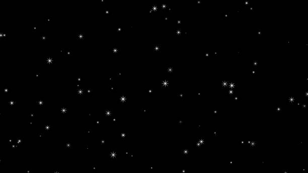 istock Glittering particles rising on a black background, particles 1433856360