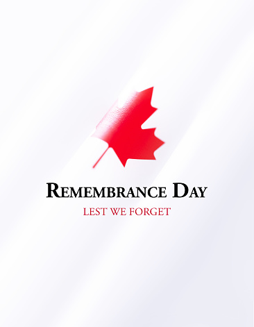 Remembrance Day message over rippled Canadian flag. Vertical composition with copy space. Front view. Remembrance Day concept.