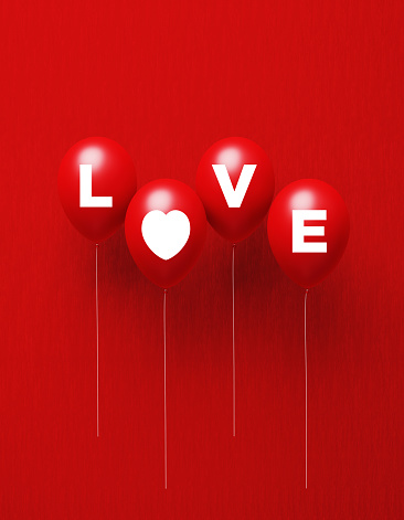 Love written red balloons on red background. Vertical composition with copy space, Great use for Valentine's Day concepts.