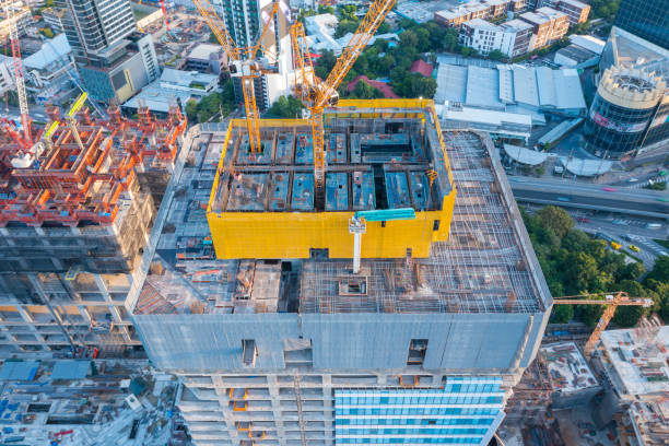 aerial view of construction site with tower crane urban construction rush hour of concrete pouring - foundation claude monet imagens e fotografias de stock