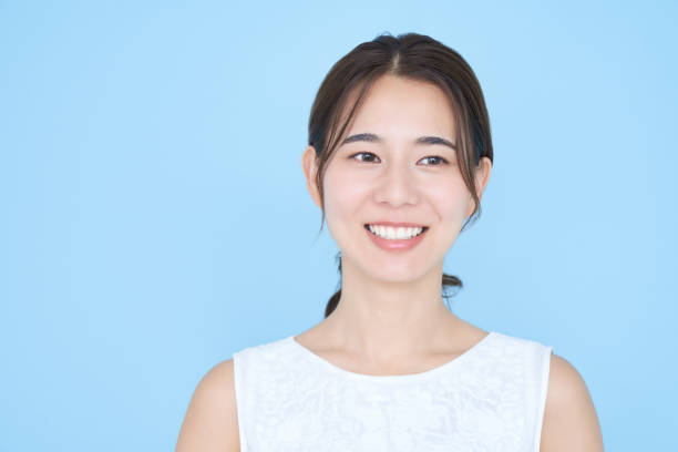 istock Young woman wearing sleeveless and blue background 1433859176