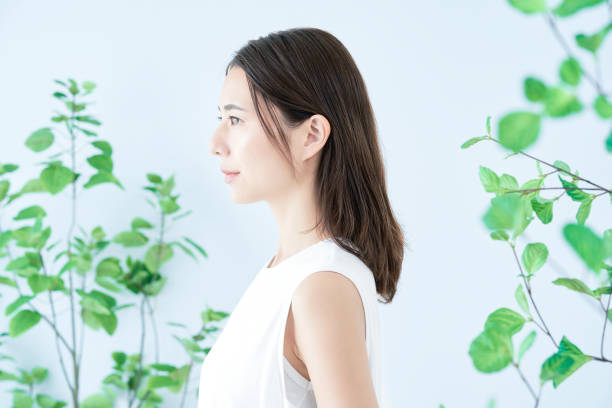 istock young woman surrounded by plants 1433859957