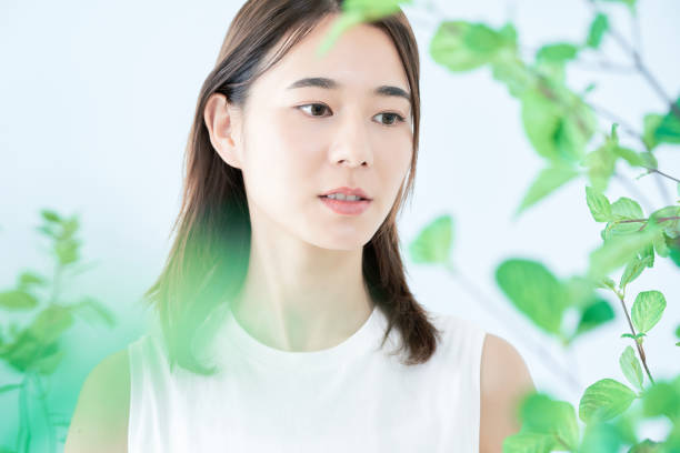 istock young woman surrounded by plants 1433860127
