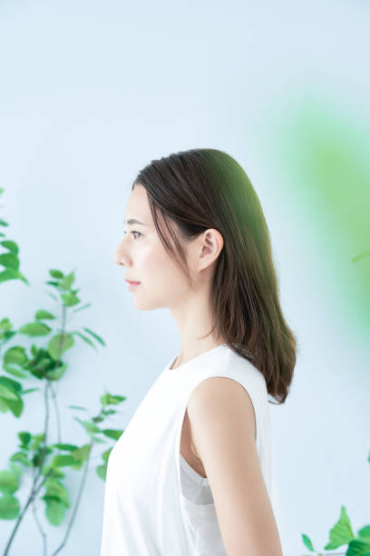 istock young woman surrounded by plants 1433860285