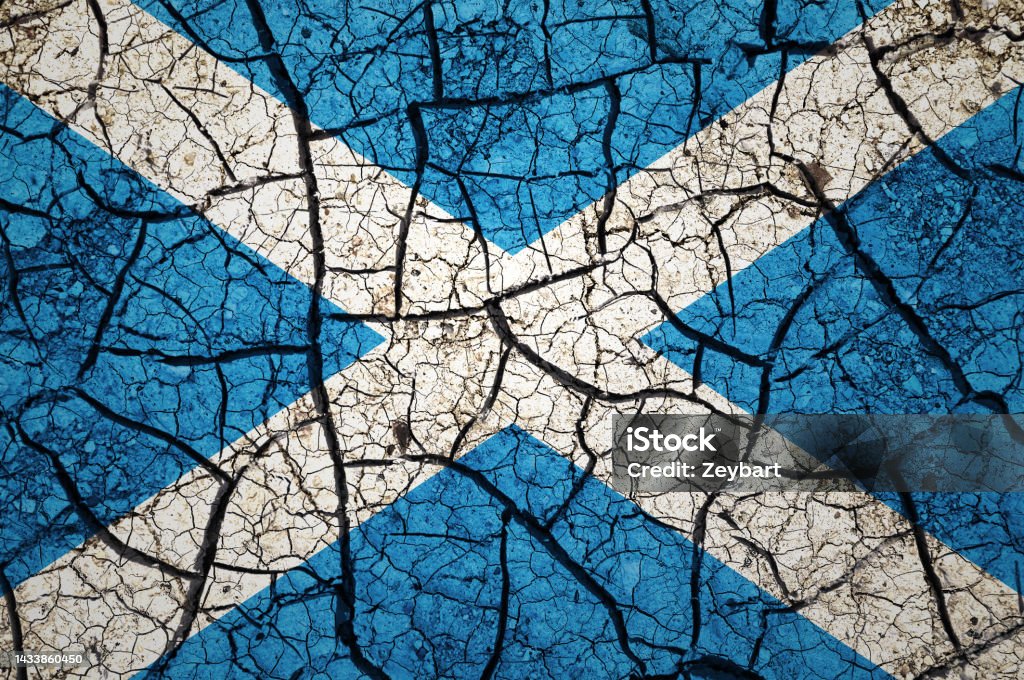 Dry soil pattern on the flag of Scotland. Country with drought concept. Water problem. Dry cracked earth country. Accidents and Disasters Stock Photo