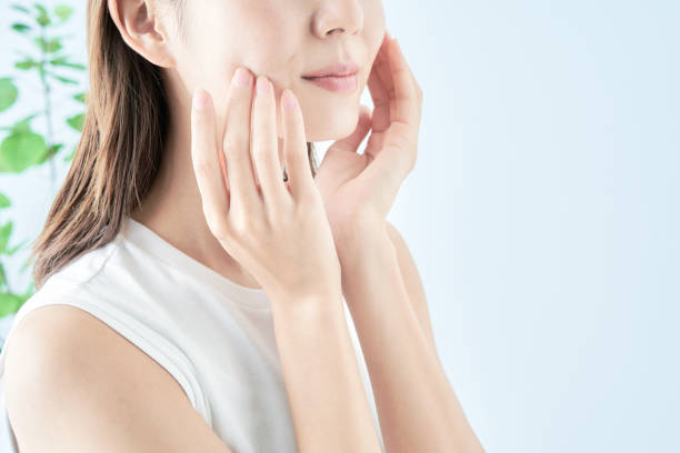 istock Young woman checking her skin condition 1433862044