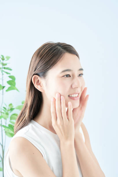 istock Young woman checking her skin condition 1433863060