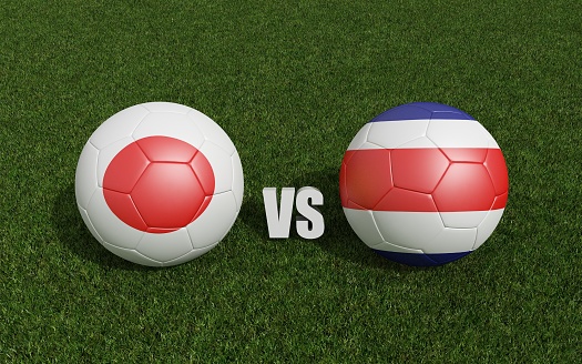 Footballs in flags colors on grass. Japan with Costa-rica. 3d rendering