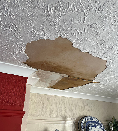 Water leak damage to living room ceiling