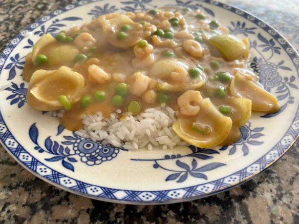 Plate of prawn curry and boiled rice