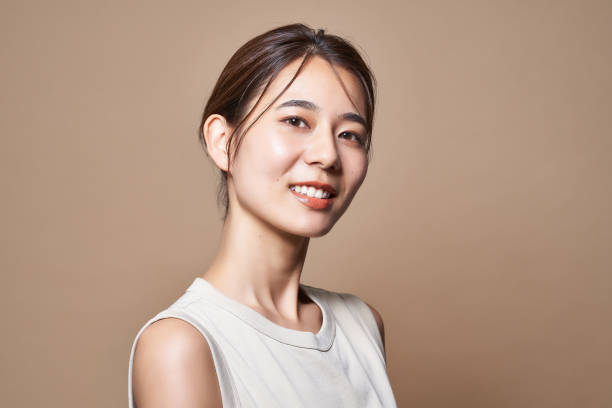 Healthy young woman and beige background