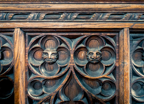 Amusing (and slightly scary) carved faces on a wooden panel in St Nicholas’ Chapel in King’s Lynn, Norfolk, Eastern England.