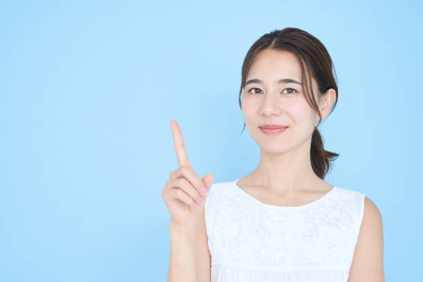 istock A young woman posing with her index finger up 1433866954