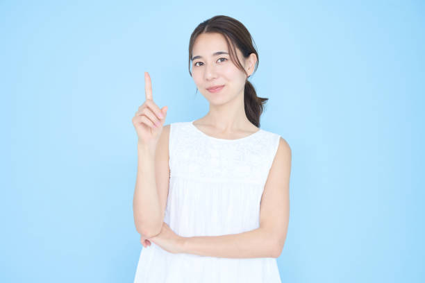 istock A young woman posing with her index finger up 1433866998