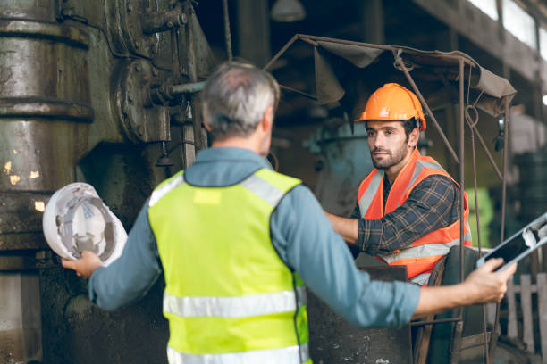 istock industrial factory with men at work concept, professional engineer foreman inspector talking in business occupation job teamwork with team, construction manager working in manufacturing technology job 1433869598