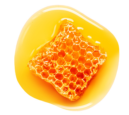 Honeycomb with flowing honey syrup isolated on white background.  Honey Flat lay. Top view. Flat lay